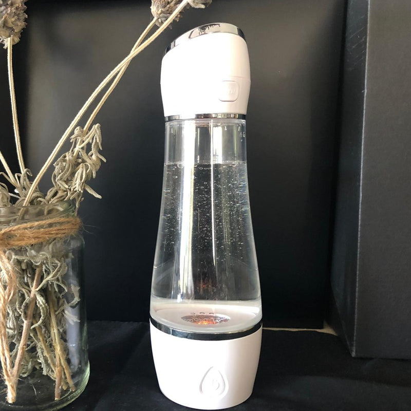 Load image into Gallery viewer, Hydrogen Water bottle in white on bench
