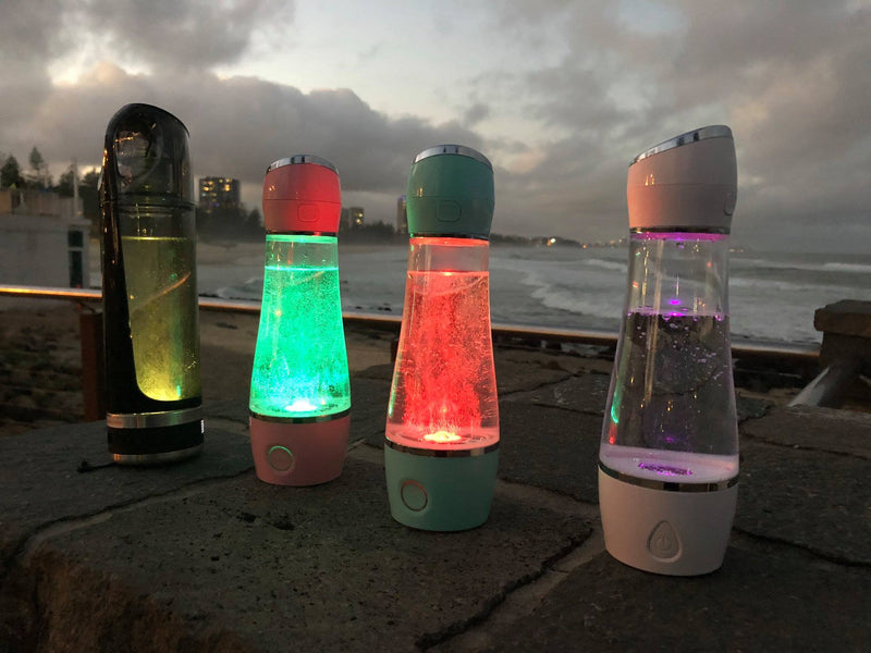 Load image into Gallery viewer, Hydrogen Water bottles at night
